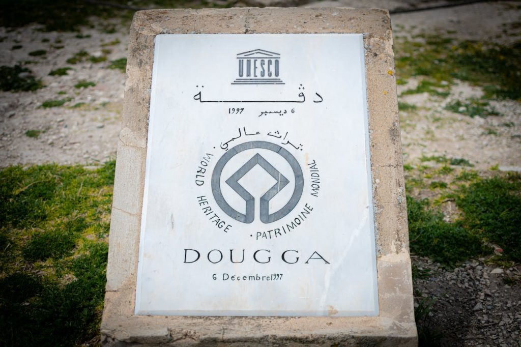 Mastering the First Impression: Your intriguing post title goes here Stone marker designating Dougga as a UNESCO World Heritage Site.